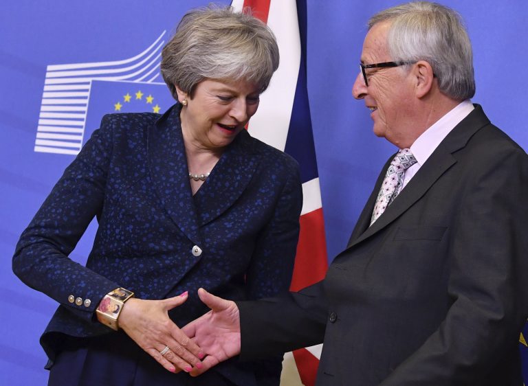 European Commission President Jean-Claude Juncker (right), shakes hands with British Prime Minister Theresa May prior to a meeting at EU headquarters in Brussels, Saturday, Nov. 24, 2018. British Prime Minister Theresa May is kicking off a big Brexit weekend by traveling to EU headquarters in Brussels for talks on Saturday with key leaders. (Geert Vanden Wijngaert/AP)