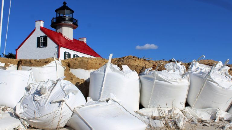 Sandbags are used to slow the erosion of the bank along the Delaware River. (Bill Barlow for WHYY)