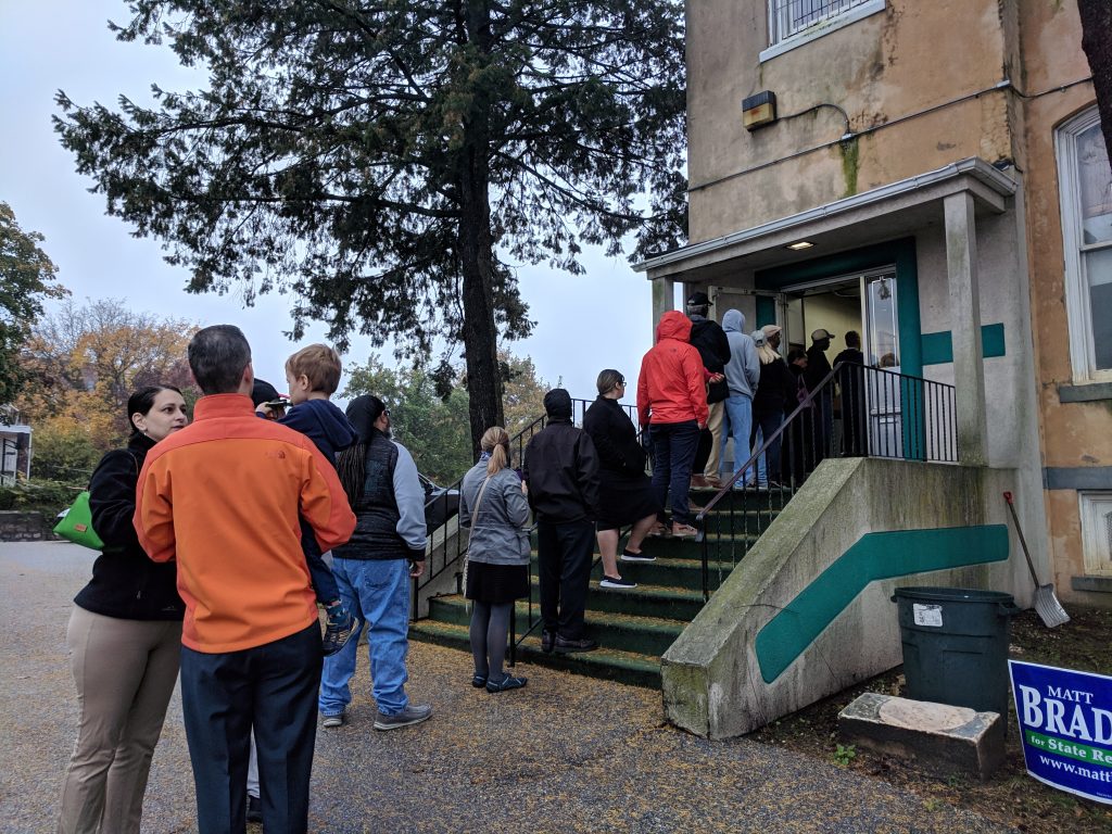 IMG_20181106_071300 People wait in line to vote just after 7 a.m. at the Local 135 union hall on Sandy Street in Norristown, Montgomery County. (Katie Colaneri/WHYY)