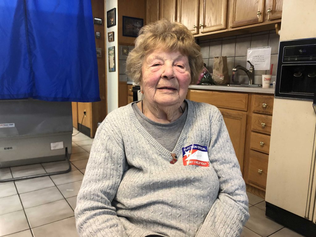 Image from iOS(4) Louise deVirgillo is 98-years-old and helping people with the voting machines. She’s been working at Brookhaven’s 2nd Precinct every election for 40 years. She says she’s “never seen people so excited for a midterm.” (Robert Brod/WHYY)