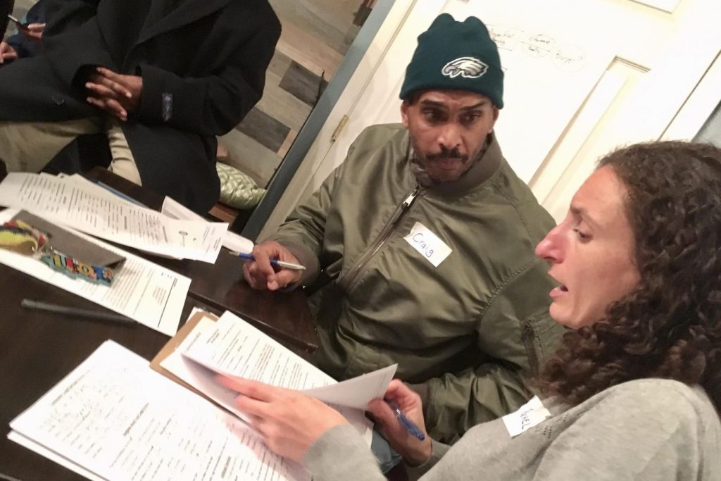 UVOA54TJ3NCA3HEOM3QBVP65AY Rachel Garland, a lawyer with Community Legal Services, meets with Craig K. Lee, 53, who has lived at the Arvilla since 2011 and now will have to move. (Courtesy of Neighbors)
