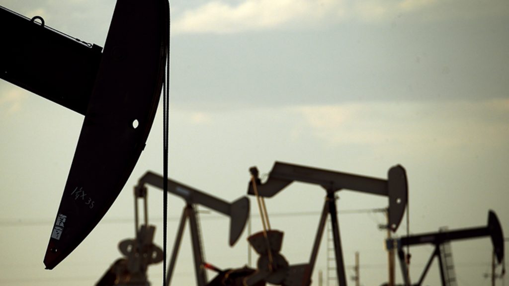 Pumpjacks work in a New Mexico field. Pumpjacks work in a New Mexico field. (Charlie Riedel/AP)