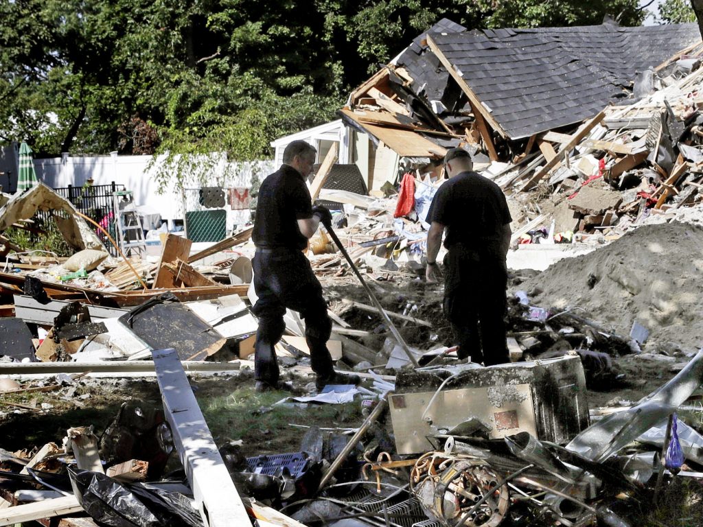 Fire investigators search the debris at a home where an explosion occurred following a gas line failure in September in Lawrence, Mass. Fire investigators search the debris at a home where an explosion occurred following a gas line failure in September in Lawrence, Mass. (Charles Krupa/AP)