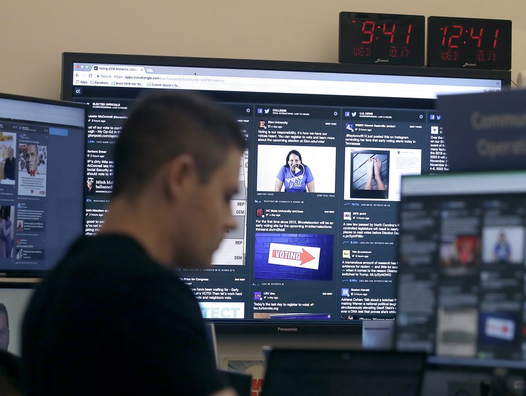 A man works at his desk in front of monitors last month during a demonstration in the war room, where Facebook monitors election-related content on the platform, in Menlo Park, Calif. A man works at his desk in front of monitors last month during a demonstration in the war room, where Facebook monitors election-related content on the platform, in Menlo Park, Calif. (Jeff Chiu/AP)