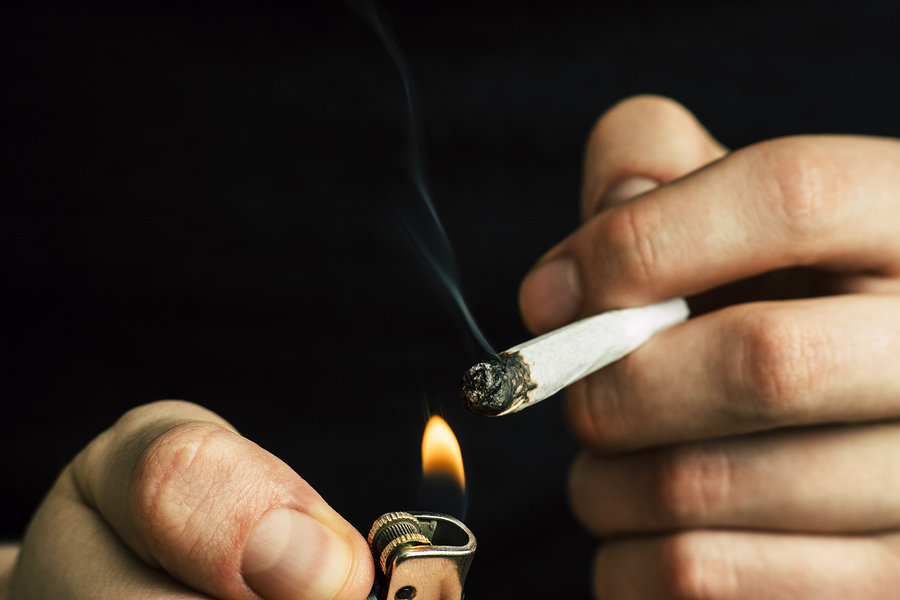 Cannabis Weed, A Joint In His Hands A Man Smokes . Smoke On A Bl The study offers several reasons why conduct problems might precede marijuana use. Kids with conduct problems are more likely to be attracted to rebellious behaviors. And marijuana is a way for troubled kids to self-medicate. (Big Stock)