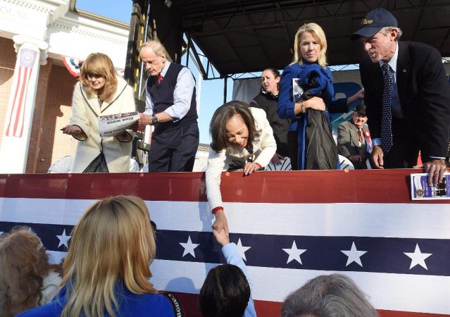 Martha Carper and her husband U.S Sen. Tom Carper, Congresswoman Lisa Blunt Rochester, Lt. Gov. Bethany Hall Long and Governor John Carney (left to right) greet Return Day attendees. (Chuck Snyder/for WHYY)