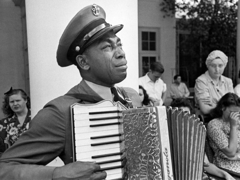 U.S. Navy CPO Graham Jackson, with tears of grief, plays 