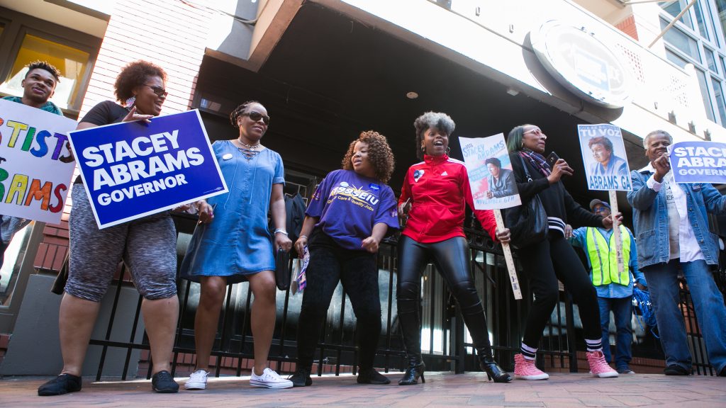 Georgia voters and supporters dance and sing during a “Souls to The Polls” march hosted by Democratic Georgia gubernatorial candidate Stacey Abrams in downtown Atlanta on Oct. 28. Alongside artist Common and Ambassador Andrew Young, Abrams marched with voters to a polling station in downtown Atlanta. Georgia voters and supporters dance and sing during a