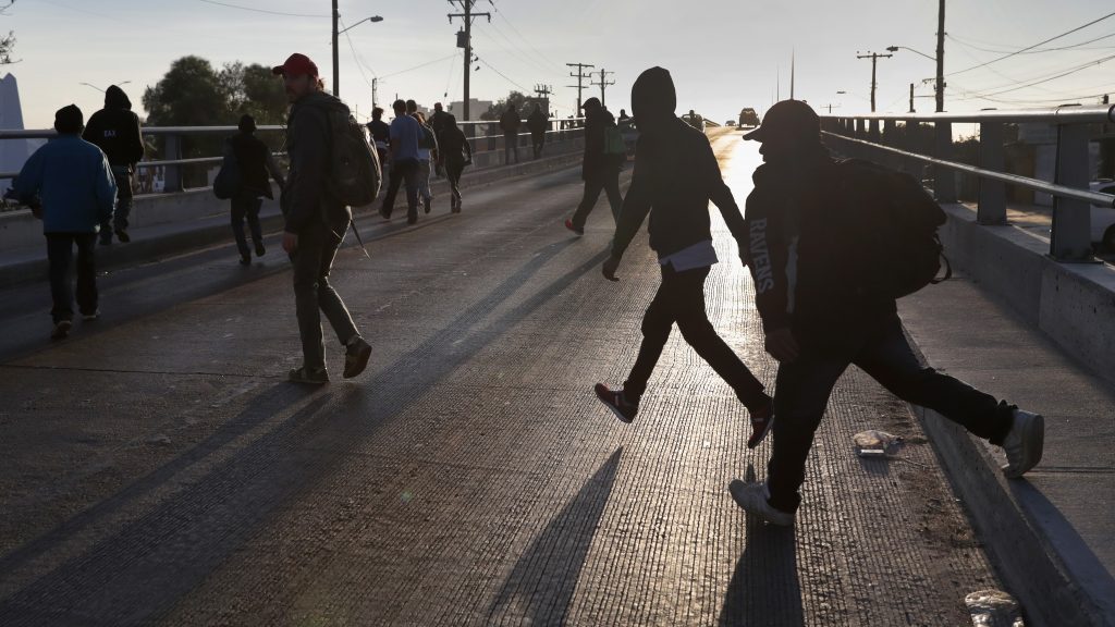 Members of the migrant caravan walk to make requests for political asylum at the U.S.-Mexico border last week in Tijuana, Mexico. Members of the migrant caravan walk to make requests for political asylum at the U.S.-Mexico border last week in Tijuana, Mexico (John Moore/Getty Images)