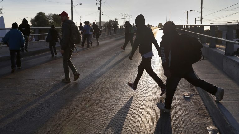 Members of the migrant caravan walk to make requests for political asylum at the U.S.-Mexico border last week in Tijuana, Mexico (John Moore/Getty Images)