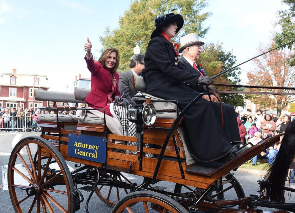 jennings Kathy Jennings waves to the Return Day crowd in 2018, two days after being elected attorney general, while riding in a horse-drawn carriage from Marvel Carriage Museum. (WHYY file)