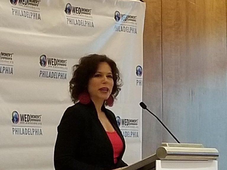 Women's Entrepreneurship Day conference organizer Elisa Bloom speaks to attendees in Philadelphia Monday. (Tom MacDonald/WHYY)
