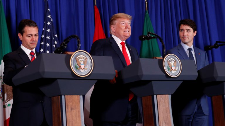 President Donald Trump signed the USMCA trade deal on Friday, alongside Canada's Prime Minister Justin Trudeau and Mexico's President Enrique Peña Nieto in Buenos Aires. (Kevin Lamarque/Reuters)
