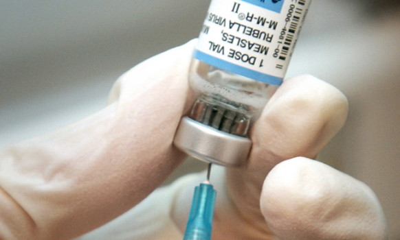 A nurse draws a dose of mumps-measles-rubella, or MMR, vaccine. (AP Photo/The Wichita Eagle, Mike Hutmacher, 2006 file)