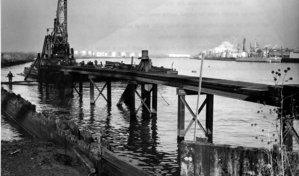 A photo circa 1965 showing an outfall pier being built on the Schuylkill River, where it flows into the Delaware River. Prior to the Clean Water Act, little regulation existed to halt industrial pollution and raw sewage from flowing into the nation's waterways. (PWD archival photo)