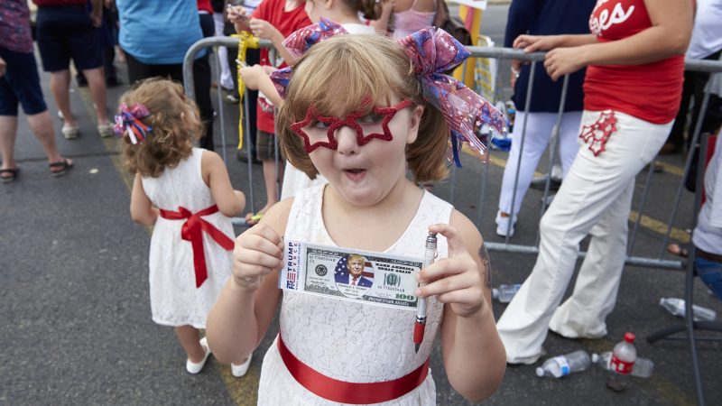 Savannah Corcoran, 6, from Plains, Pennsylvania, came to see President Donald Trump at the Make America Great Again rally in Wilkes-Barre on Aug. 2, 2018. She dressed in patriotic garb, which she found earlier that day at Joann Fabric. (Natalie Piserchio for WHYY)