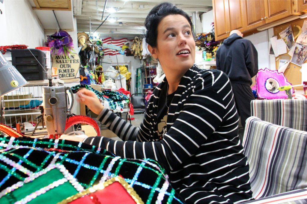 2018 12 17-e lee-amanda kiesel-philadelphia avalon string band-costume maker Amanda Kiesel sews Velcro onto sequined suspenders at the Avalon String Band club house in South Philadelphia while costume coordinator Jimmy Tatar uses a glue gun to add feathers to a hat.