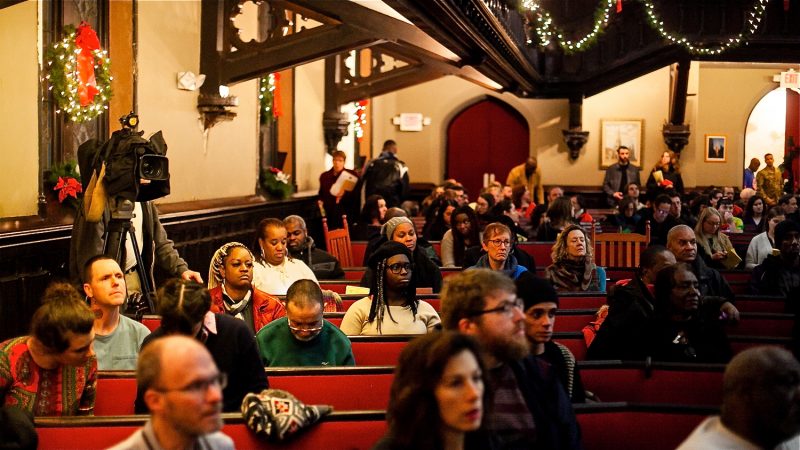 Philadelphians, some formerly and currently homeless, attend a Homeless Memorial Day Service at Arch Street United Methodist Church Thursday evening. (Brad Larrison for WHYY)