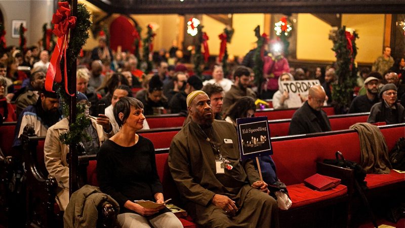 Philadelphians, some formerly and currently homeless, attend a Homeless Memorial Day Service at Arch Street United Methodist Church Thursday evening. (Brad Larrison for WHYY)