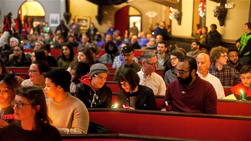 Candles are lit in memory of those who have died living on the streets of Philadelphia at a Homeless Memorial Day service at Arch Street United Methodist Church Thursday evening. (Brad Larrison for WHYY)
