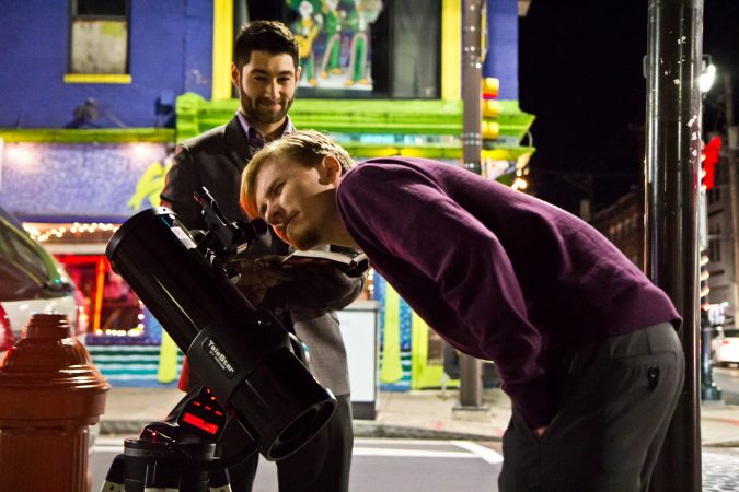 The Philadelphia Moon Men invite people on the streets of Philadelphia to gaze at the moon. (Kimberly Paynter/WHYY)