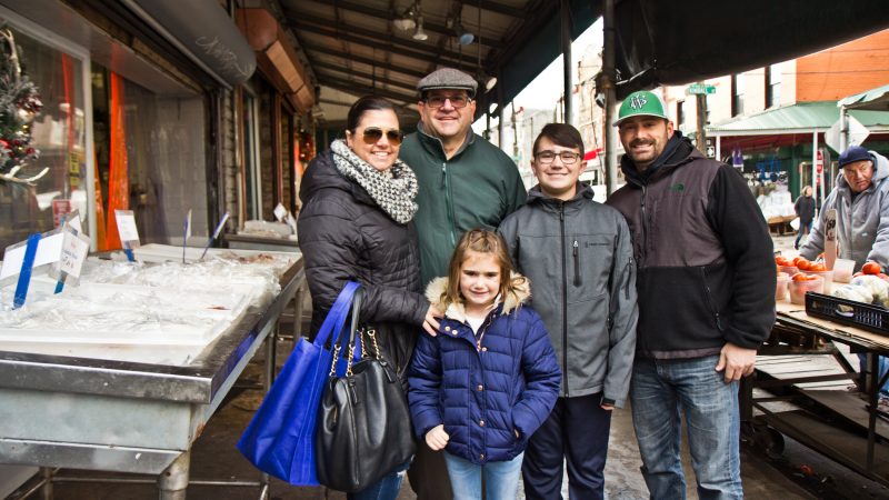 Michael Nicolosi and his daughter Melissa Gasparovic and her family shop for fish for Christmas Eve dinner. (Kimberly Paynter/WHYY)