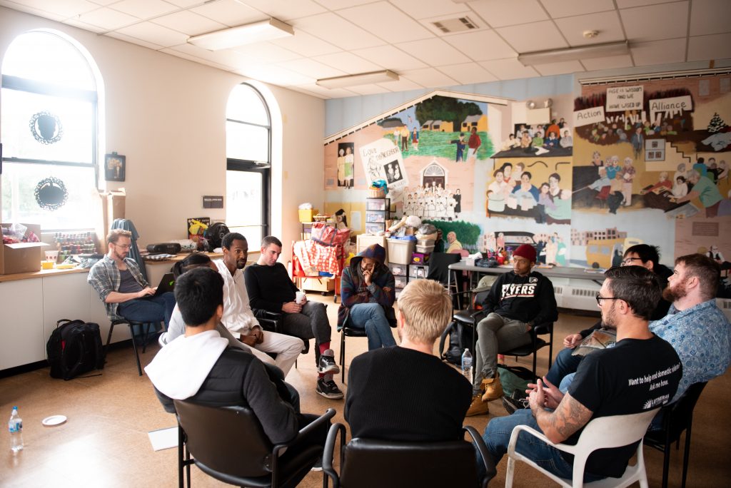 20181028_WHYY_Masculinity Workshop_006 Participants in a masculinity workshop discuss a reading at Lutheran Settlement House on Sunday, October 28, 2018. (Kriston Jae Bethel for WHYY)