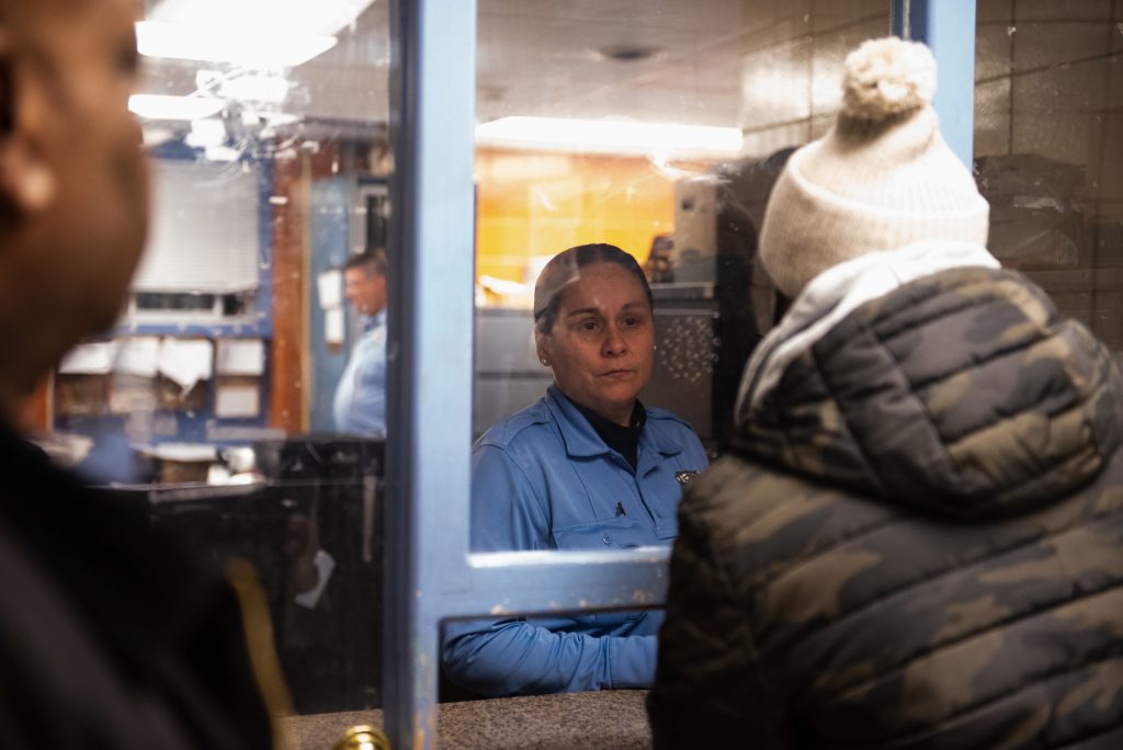 20181130_WHYY_Community Crisis Intervention Program_123 Officer Toledo from the 35th Police District informs James Shuler and other members of the Community Crisis Intervention Program that there have been no recorded instances of violent crime for the day. (Kriston Jae Bethel for WHYY)