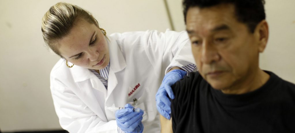 AP_111207099818-e1544129417178-1920×869 The Carver Senior Center hosts a flu clinic Dec. 7, 2011, in New York. (Jason DeCrow/AP Images for American Lung Association)