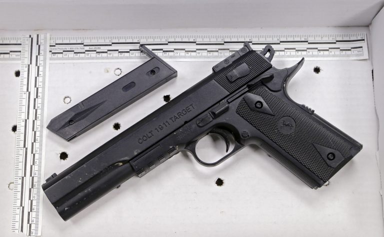 In this Nov. 26, 2014, file photo, a fake handgun resembling a Colt 1911 pistol, taken from Tamir Rice after he was fatally shot by Cleveland police, is displayed after a news conference in Cleveland. (Mark Duncan/AP Photo, File)