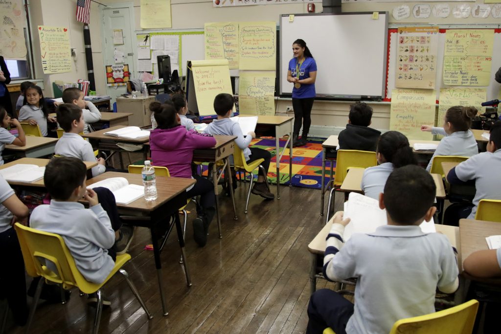 Olympian School Reading A second grade class in Newark, N.J. (Julio Cortez/AP Photo)
