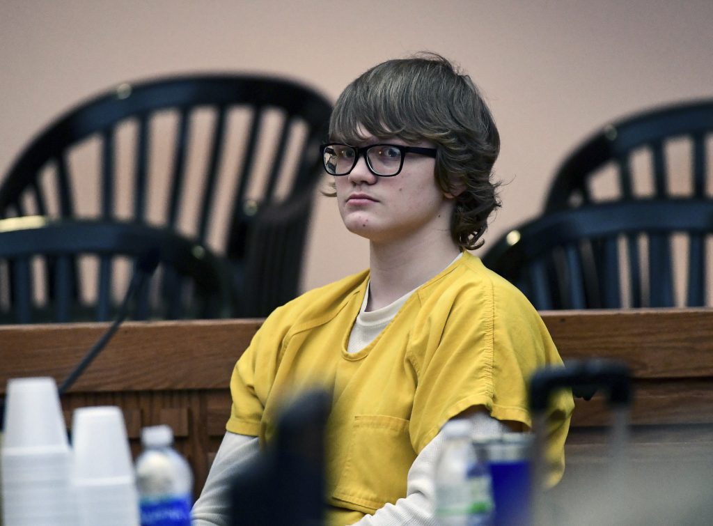 SCAND102 Jesse Osborne waits for a ruling at the Anderson County Courthouse on Friday, Feb. 16, 2018. Osborne, a boy who was 14 when he was charged in the shooting death of his father at their home and a first-grader on a South Carolina elementary school playground will be tried as an adult, a judge ruled Friday. (Ken Ruinard/The Independent-Mail via AP, Pool)