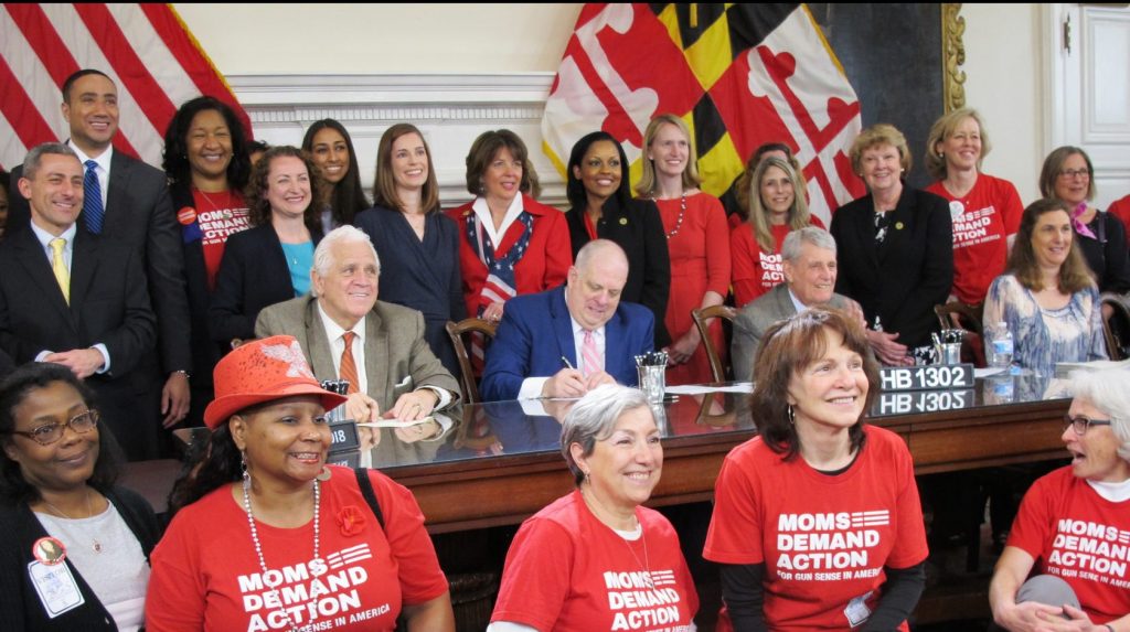AP_18114613919190-e1544760149878-1920×941 Maryland Gov. Larry Hogan signs legislation to enable judges to order people to temporarily give up their firearms if they are found to pose an immediate danger, one of more than 200 bills he signed on Tuesday, April 24, 2018, in Annapolis, Md. Hogan also signed a bill to ban bump stocks, which can increase a semi-automatic rifle's firing rate, as well as a bill to require convicted domestic abusers to surrender guns to law enforcement or a firearms dealer. ( Brian Witte / The Associated Press)