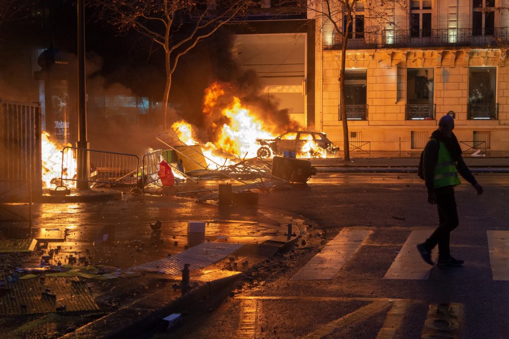 Yellow vests (Gilets jaunes) protest against rising oil prices and living costs on the Champs Elysees in Paris, France, on December 1, 2018. Thousands of anti-government protesters are expected today on the Champs-Elysees in Paris, a week after a violent demonstration on the famed avenue was marked by burning barricades and rampant vandalism that President Emmanuel Macron compared to 