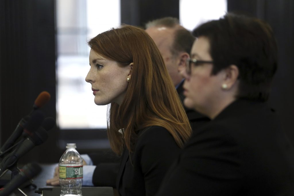 Sexual Misconduct New Jersey FILE: Katie Brennan, (left), then-chief of staff at the New Jersey Housing and Mortgage Finance Agency, listens to a question as she testifies before the Select Oversight Committee at the Statehouse, Tuesday, Dec. 4, 2018, in Trenton, N.J. (Mel Evans/AP Photo)