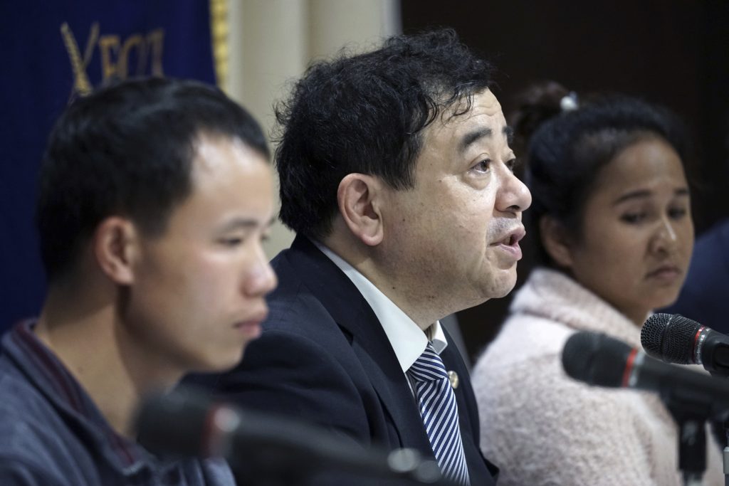 Japan Foreign Labor In this Nov. 28, 2018, photo, lawyer Shoichi Ibusuki, (center), attends a press conference on the problems in Japan's technical intern program, with Eng Pisey, (right), Cambodian technical intern and Huang Shihu, left, Chinese technical intern in Tokyo. Ibusuki, lawyer specializing in labor cases and supporting victimized foreign students and interns, called the internship program as a disguise to use trainees as mere cheap labor and should be scrapped and replaced with the new program underway. Japan is set to approve legislation that would officially open the door to foreign workers to do unskilled jobs and possibly eventually become citizens. (Eugene Hoshiko/AP Photo)