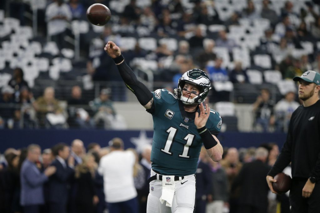 Eagles Cowboys Football Philadelphia Eagles quarterback Carson Wentz (11) throws a pass throws a pass during warm ups before an NFL football game against the Dallas Cowboys in Arlington, Texas, Sunday, Dec. 9, 2018. (AP Photo/Michael Ainsworth)