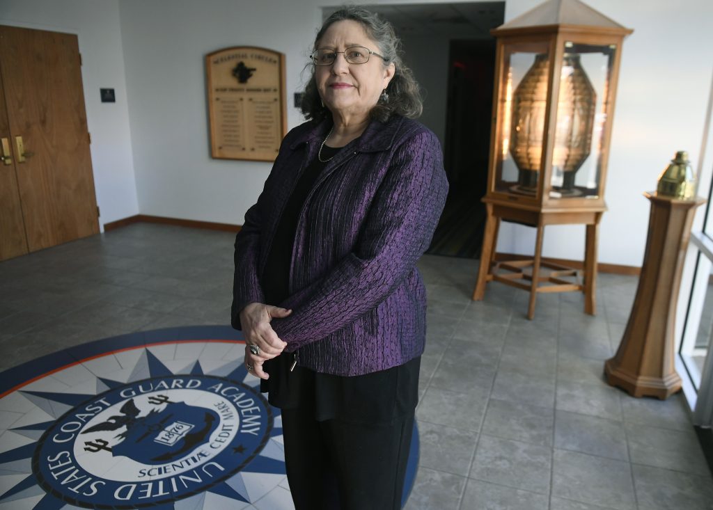 In this Tuesday, Dec. 18, 2018 photo, Michele Fitzpatrick, a retired lieutenant commander in the Coast Guard, poses for a photograph at the United States Coast Guard Academy in New London, Conn. Female veterans, both current and former service members, were more likely to vote in the 2018 midterm elections for Democrats than Republicans, 60 percent to 36 percent, according to data from VoteCast. (AP Photo/Jessica Hill)