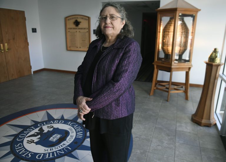 In this Tuesday, Dec. 18, 2018 photo, Michele Fitzpatrick, a retired lieutenant commander in the Coast Guard, poses for a photograph at the United States Coast Guard Academy in New London, Conn. Female veterans, both current and former service members, were more likely to vote in the 2018 midterm elections for Democrats than Republicans, 60 percent to 36 percent, according to data from VoteCast. (AP Photo/Jessica Hill)