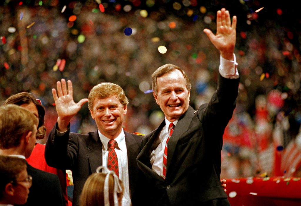 FILE - In this Aug. 18, 1988 file photo, Republican presidential candidate, Vice President George H.W. Bush,  right, and his running mate Sen. Dan Quayle, R-Ind., wave to the assembly of the Republican National Convention in New Orleans after their acceptance speeches for the presidential and vice-presidential nomination.  (AP Photo/J. Scott Applewhite, File)