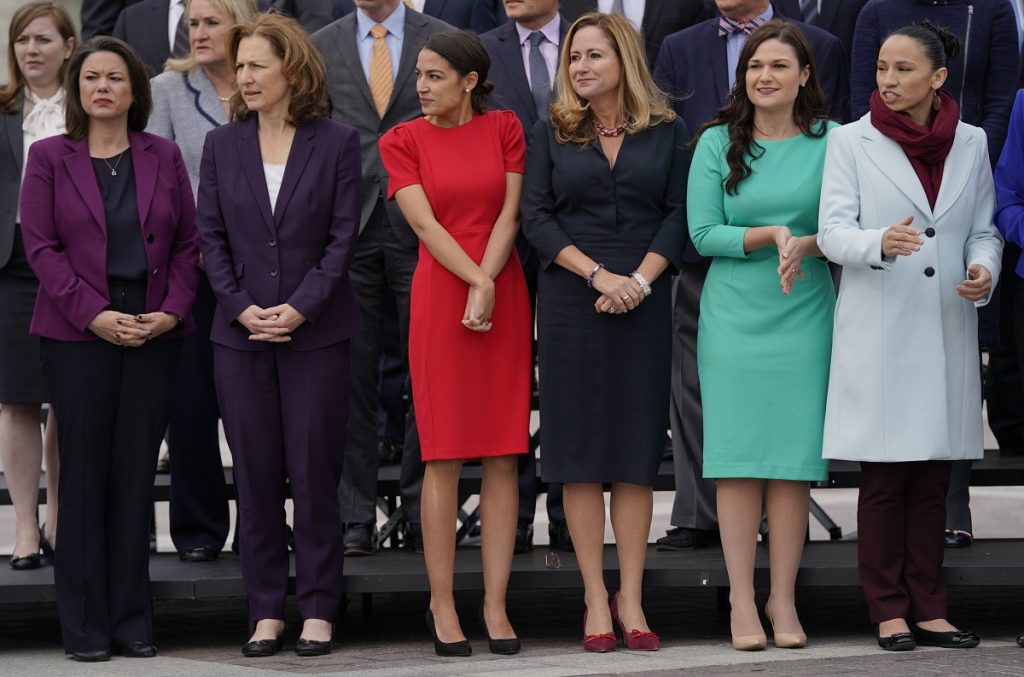 Angie Craig, Alexandria Ocasio-Ortiz, Kim Schrier, Abby Finkenauer, Sharice Davids From l-r., Rep.-elect Angie Craig, D-Minn., Rep.-elect Kim Schrier, D-WA., Rep.-elect Alexandria Ocasio-Cortez, D-NY., Rep.-elect Debbie Mucarsel-Powell, D-Fla., Rep.-elect Abby Finkenauer, D-Iowa, and Rep.-elect Sharice Davids, D-KS., line up as they join other members of the freshman class of Congress for a group photo on Capitol Hill in Washington, Wednesday, Nov. 14, 2018. (AP Photo/Pablo Martinez Monsivais)