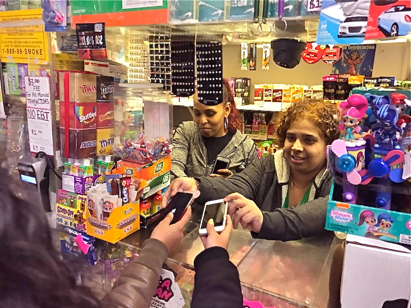 IMG_0011 Employees at Nelvin Grocery hold phones for students free of charge. (Courtesy of Ronnie Polaneczky)