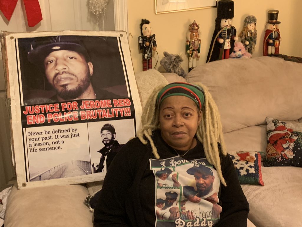 IMG_0375 Sheila Reid, whose son, Jerame, was shot and killed by police in 2014, has urged Gov. Phil Murphy to sign a bill requiring New Jersey to investigate all police-involved deaths. She’s sitting in front of a poster made to remember him, that spells his name the way it’s pronounced. (Ang Santos for WHYY)