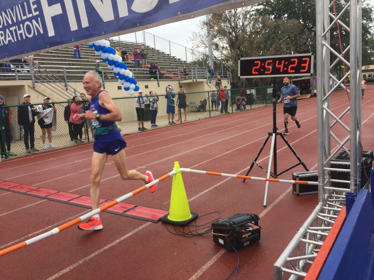 Gene Dykes crosses finish line in record time at Jacksonville Marathon (Courtesy Mark Grubb)