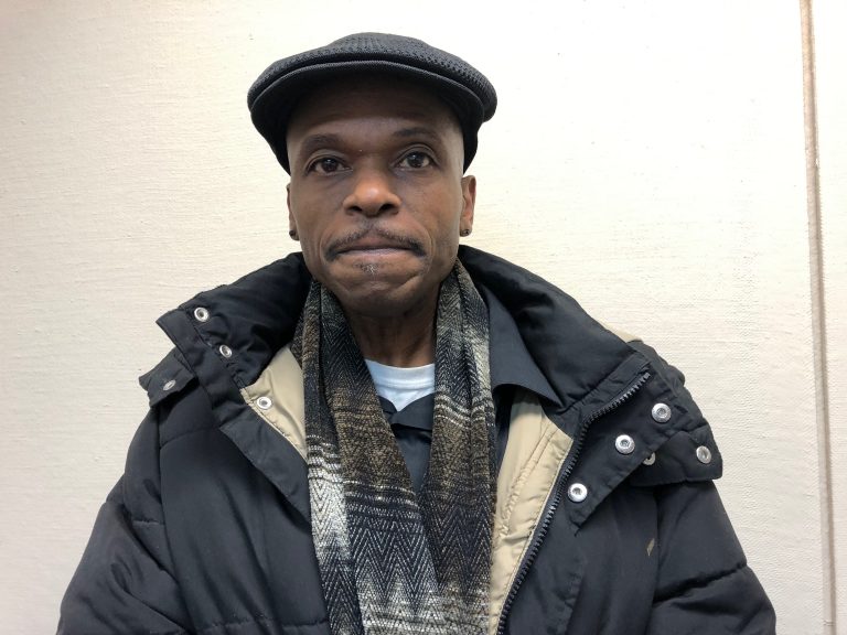 Robert Still, a former inmate living in Camden, owes about $2,000 in municipal court fines he says he is unable to afford. (Joe Hernandez/WHYY)