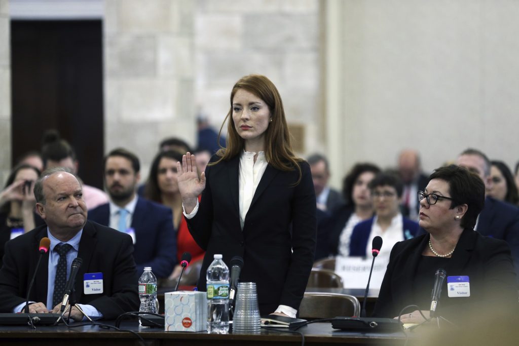 Sexual Misconduct New Jersey In December 2018, Katie Brennan, the chief of staff at the New Jersey Housing and Mortgage Finance Agency, raises her hand as she is sworn in to testify before the Select Oversight Committee at the Statehouse in Trenton, N.J. (Mel Evans/AP Photo)