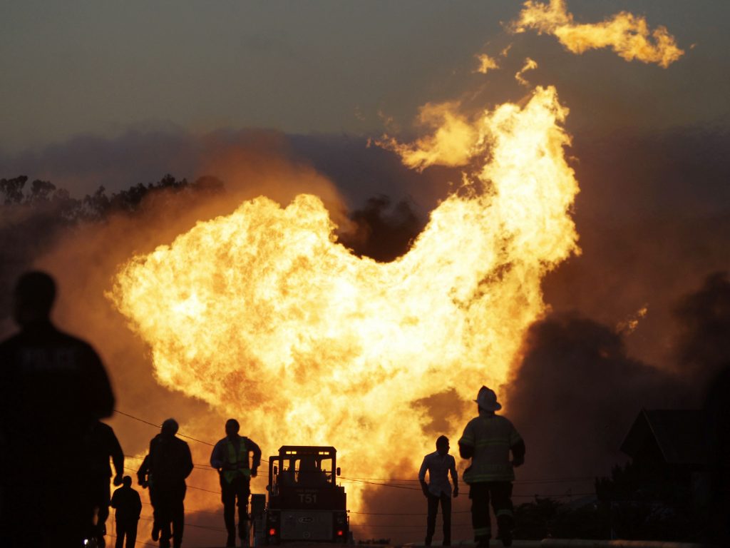 A massive fire roars through a neighborhood in San Bruno, Calif., after a PG&E gas pipeline ruptured, killing eight people, in 2010. A massive fire roars through a neighborhood in San Bruno, Calif., after a PG&E gas pipeline ruptured, killing eight people, in 2010. (Paul Sakuma/AP)