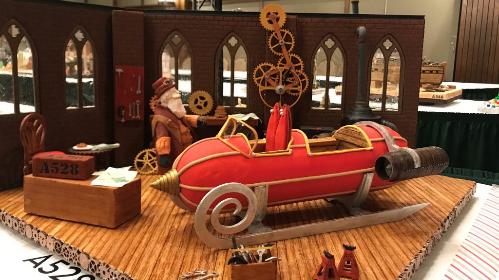 For this year’s grand prize winner, the judges were impressed by the intricate, working gingerbread gears of the clock inside Santa’s workshop. For this year's grand prize winner, the judges were impressed by the intricate, working gingerbread gears of the clock inside Santa's workshop. (Kristen Hartke/NPR)