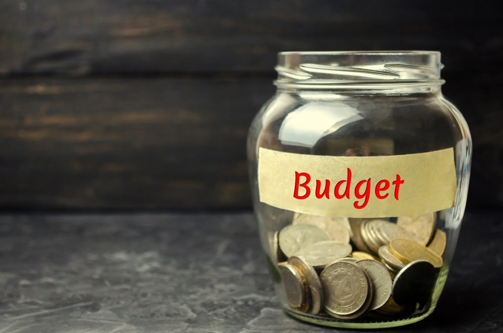 Glass Jar With Coins And The Inscription “budget”. The Concept O