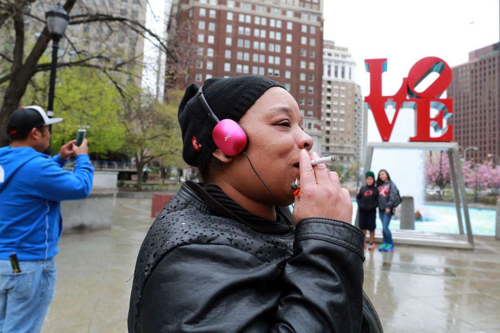 phillyinquirer A woman smokes a cigarette at JFK Plaza (David Swanson/Philadelphia Inquirer)